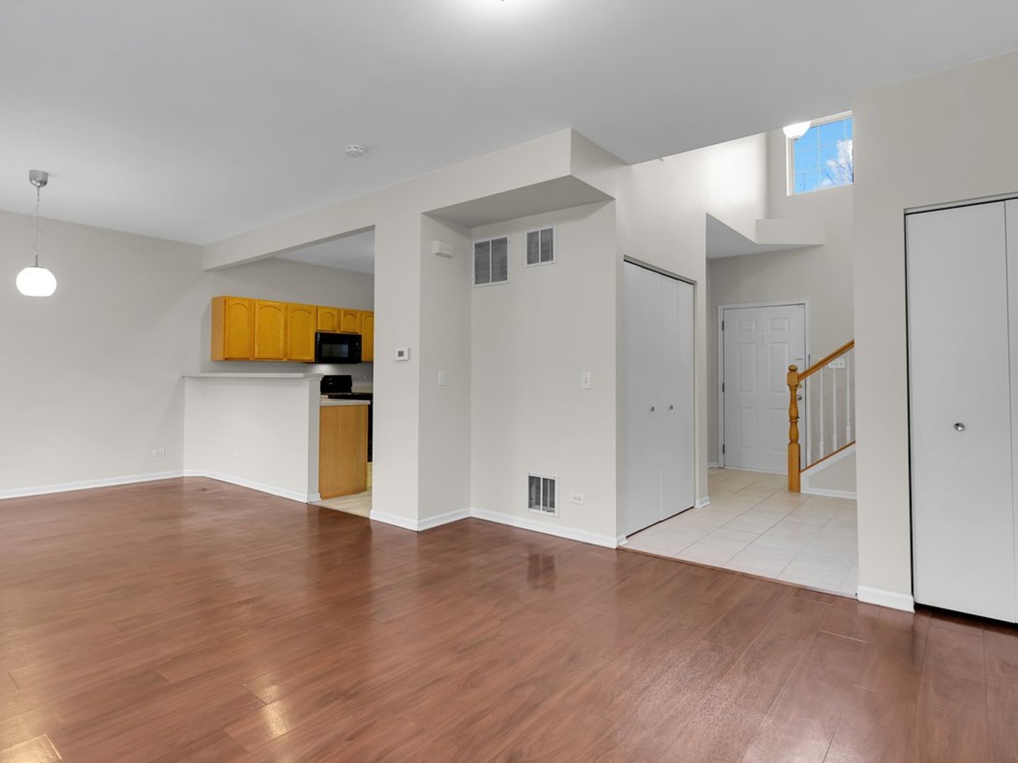 10089 Thornton Way Huntley, IL 60142 - Photo 5 of 16 a view of empty room with wooden floor