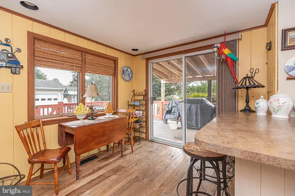 a very nice looking room with a large window and dining table