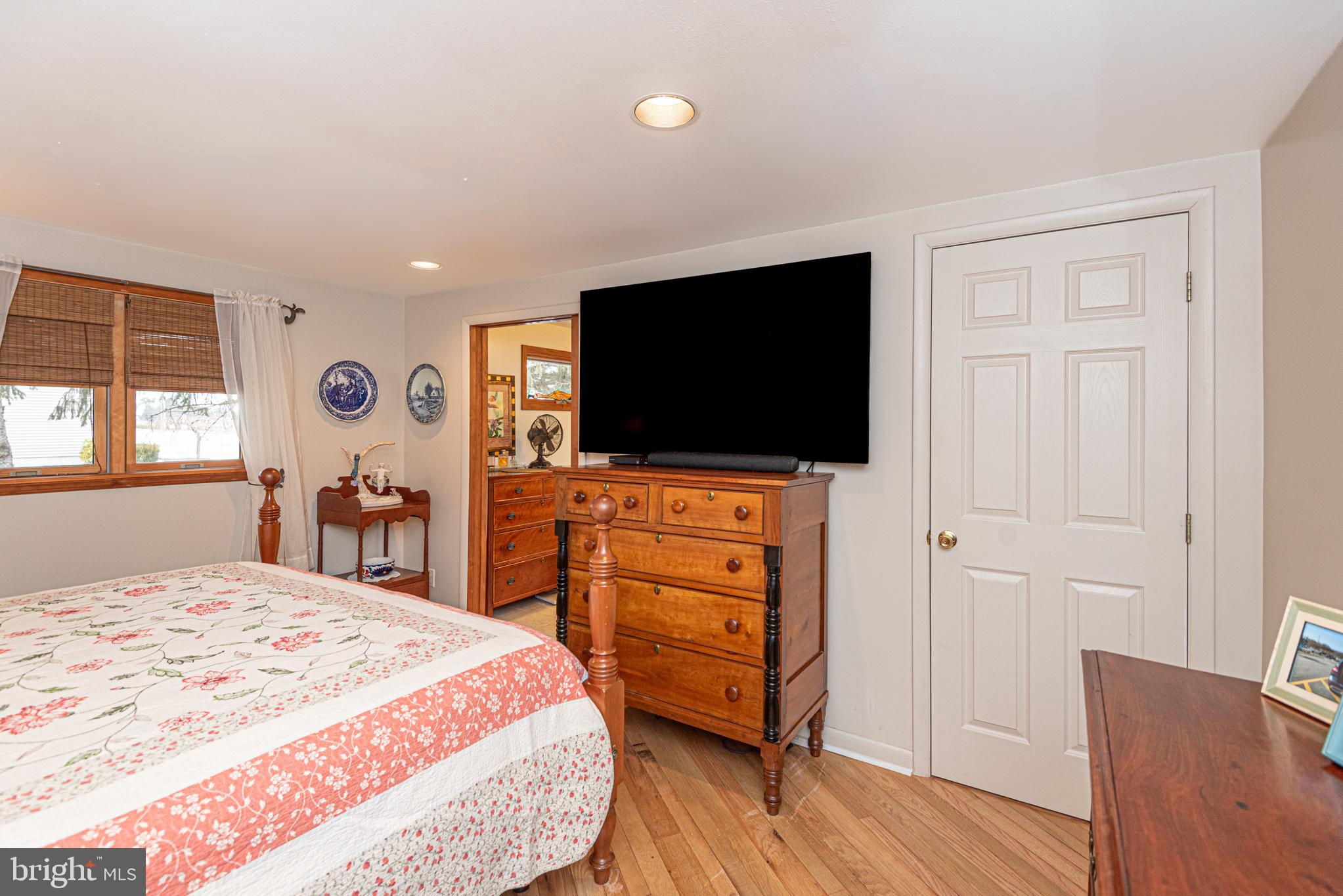 31468 Wingate Road Dagsboro, DE 19939 - Photo 17 of 45 a bedroom with a bed and a flat screen tv