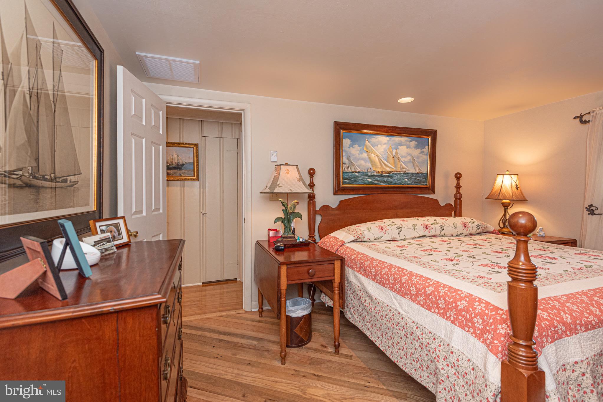 31468 Wingate Road Dagsboro, DE 19939 - Photo 19 of 45 a bedroom with a bed and wooden floor