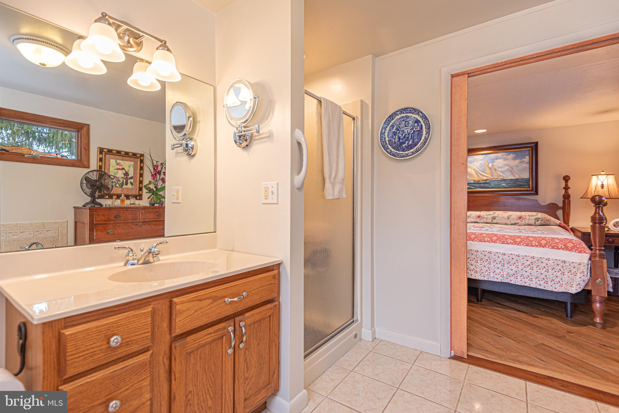 31468 Wingate Road Dagsboro, DE 19939 - Photo 21 of 45 a bathroom with a sink and a mirror
