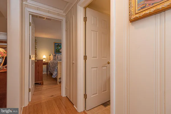 a view of a bathroom from a hallway
