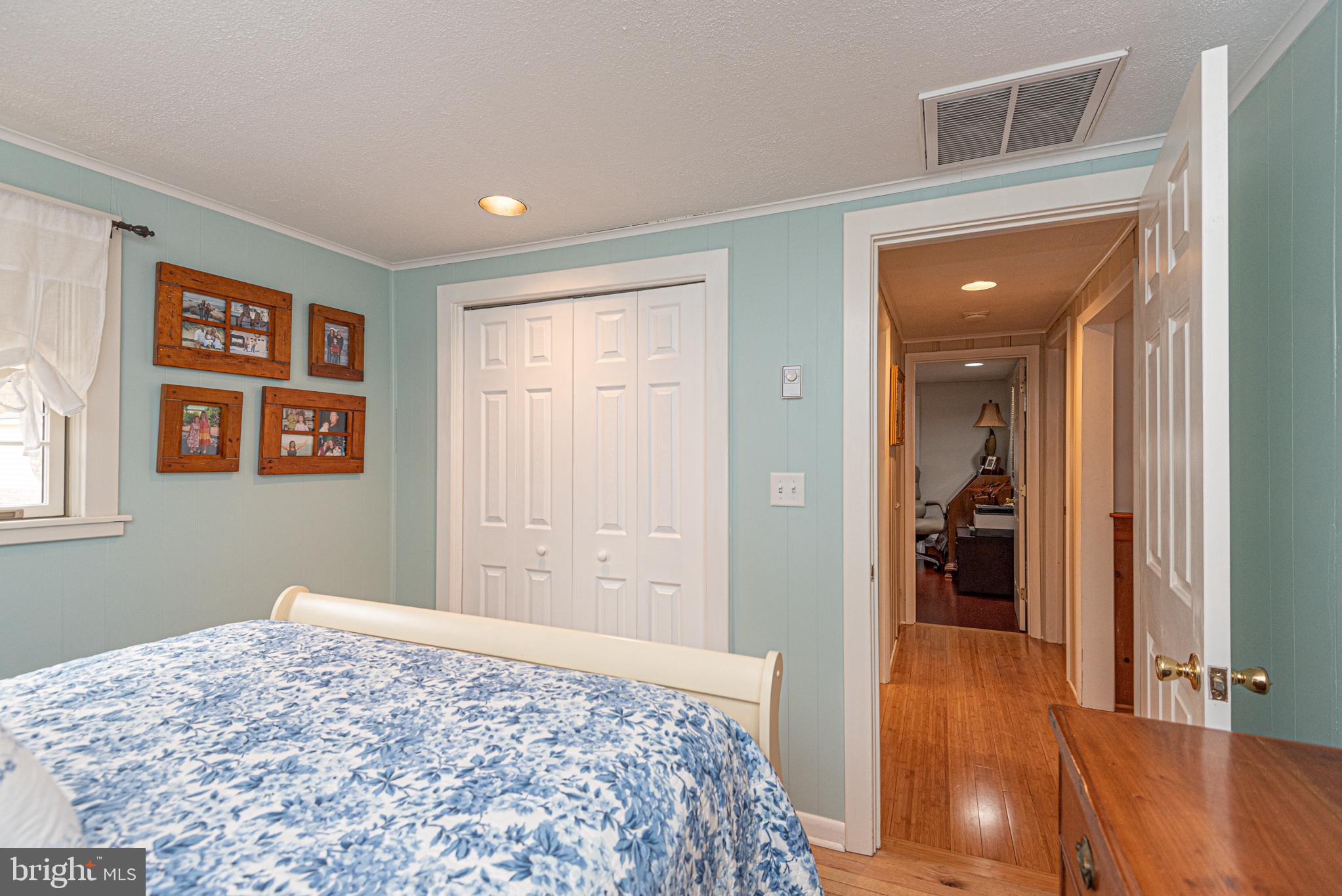 31468 Wingate Road Dagsboro, DE 19939 - Photo 27 of 45 a bedroom with a bed and wooden floor