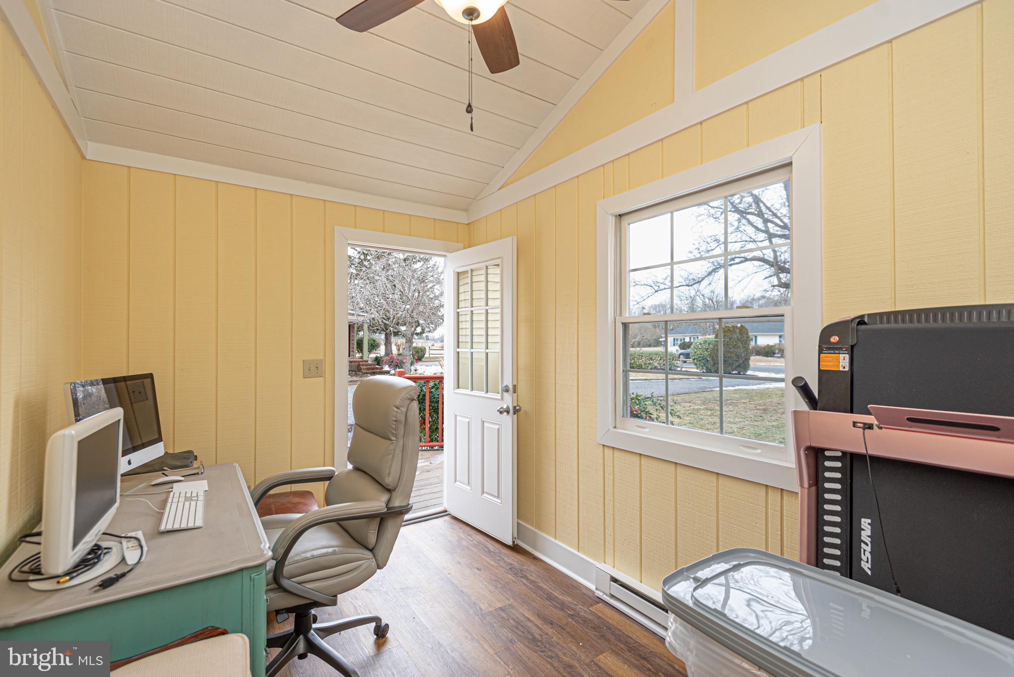 31468 Wingate Road Dagsboro, DE 19939 - Photo 33 of 45 a work room with furniture a flat screen tv and a window