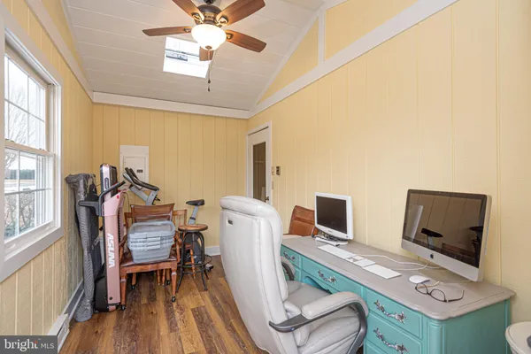 a workspace with furniture and a window