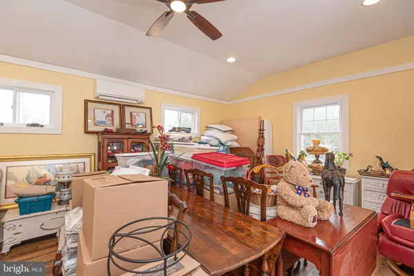 a room with a table chairs and a dining table