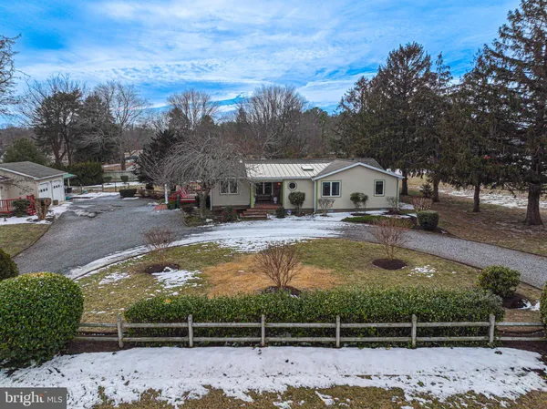a view of yard with swimming pool and trees