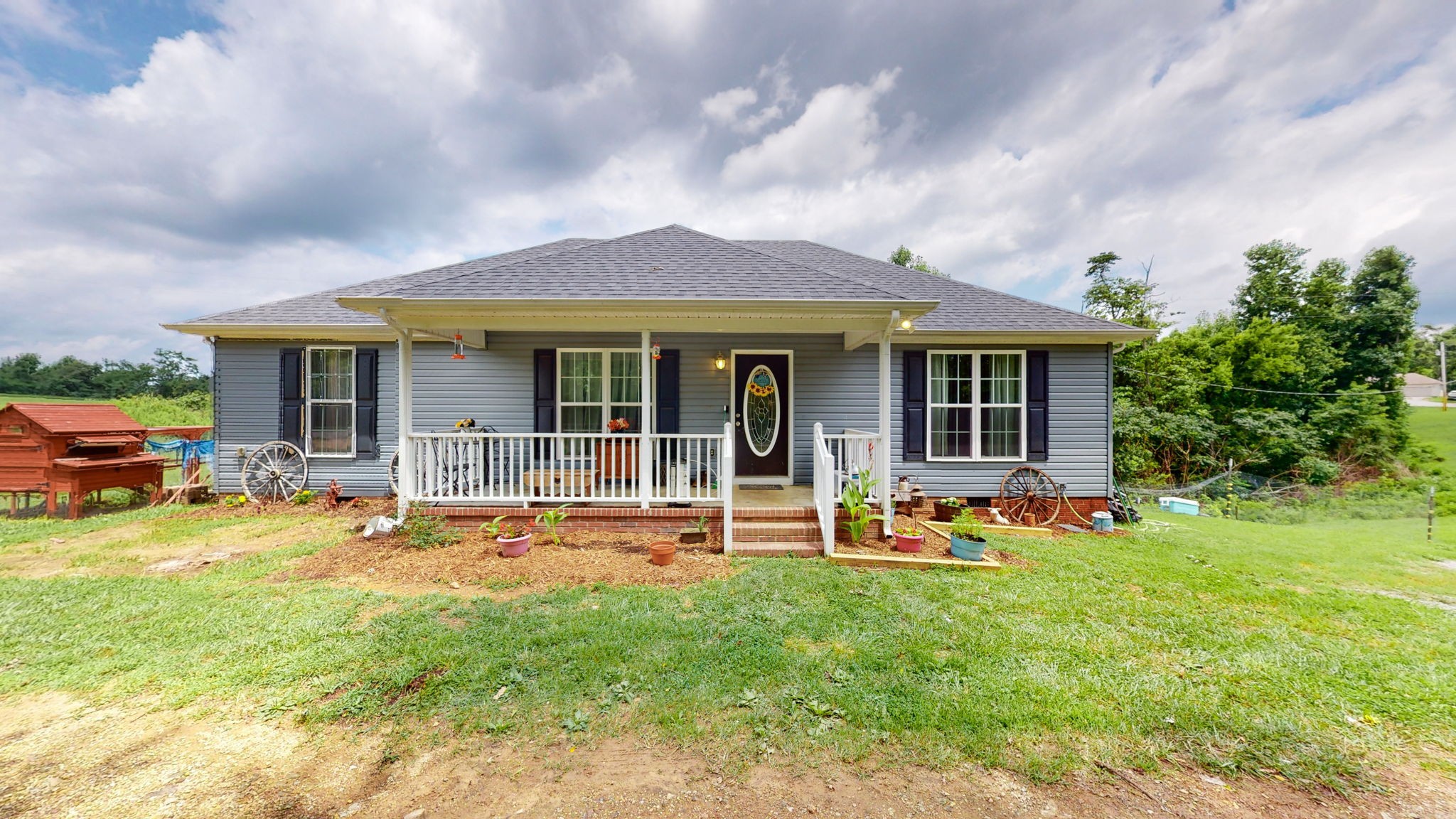 7018 Charity Road Petersburg, TN 37144 - Photo 1 of 25 a front view of house with yard and seating area