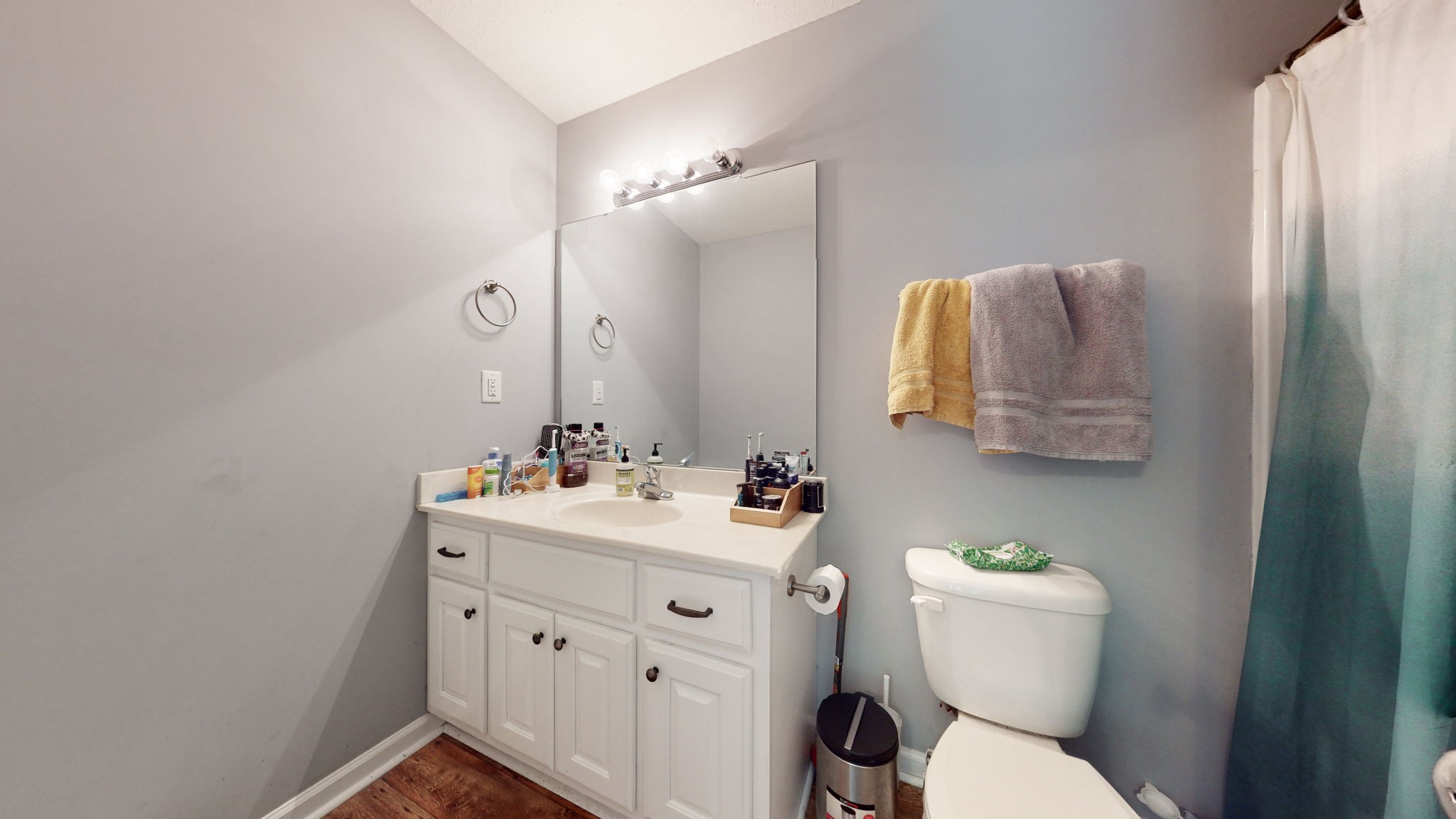 7018 Charity Road Petersburg, TN 37144 - Photo 12 of 25 a bathroom with a toilet sink vanity and mirror