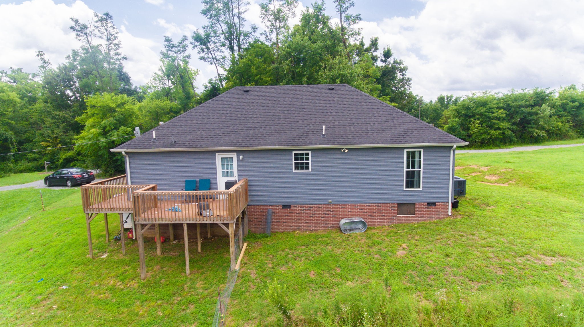 7018 Charity Road Petersburg, TN 37144 - Photo 2 of 25 a backyard of a house with table and chairs