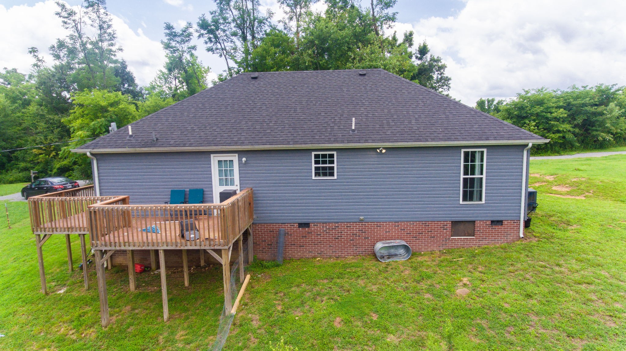 7018 Charity Road Petersburg, TN 37144 - Photo 22 of 25 a backyard of a house with table and chairs