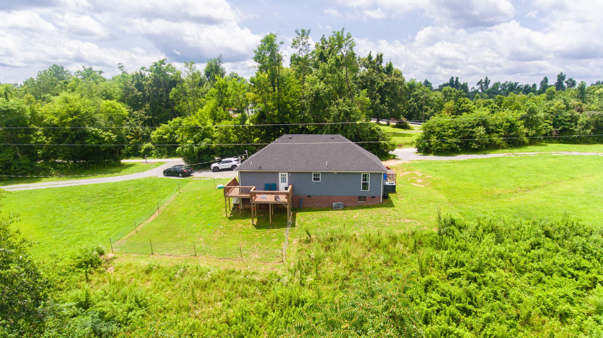 7018 Charity Road Petersburg, TN 37144 - Photo 23 of 25 a backyard of a house with table and chairs