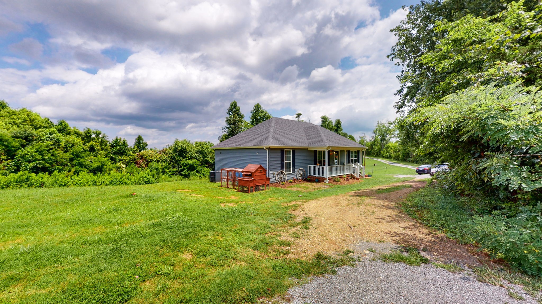 7018 Charity Road Petersburg, TN 37144 - Photo 24 of 25 a view of a house with swimming pool and garden