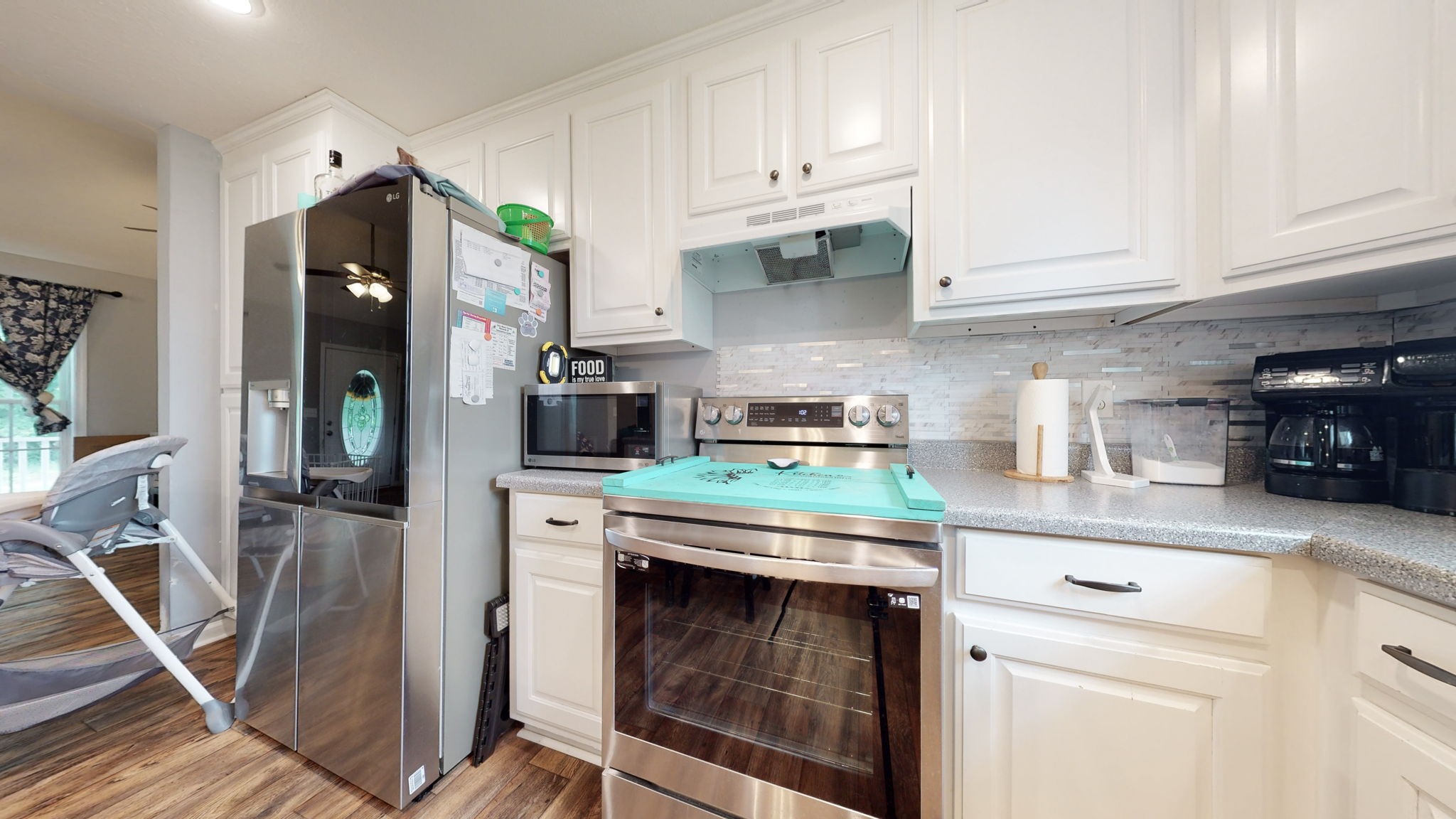 7018 Charity Road Petersburg, TN 37144 - Photo 6 of 25 a kitchen with stainless steel appliances granite countertop a stove and a refrigerator