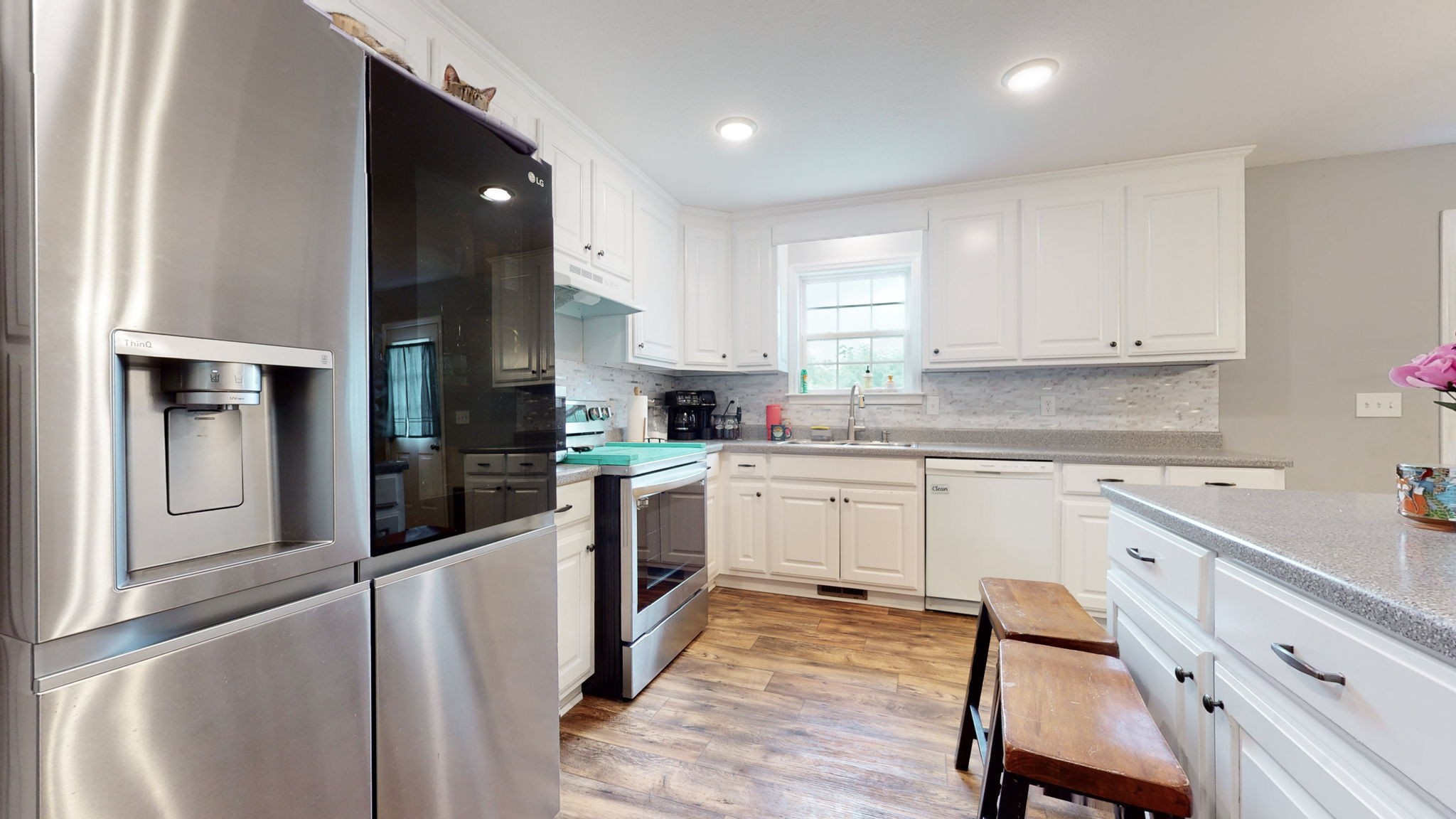 7018 Charity Road Petersburg, TN 37144 - Photo 7 of 25 a kitchen with granite countertop white cabinets and white appliances