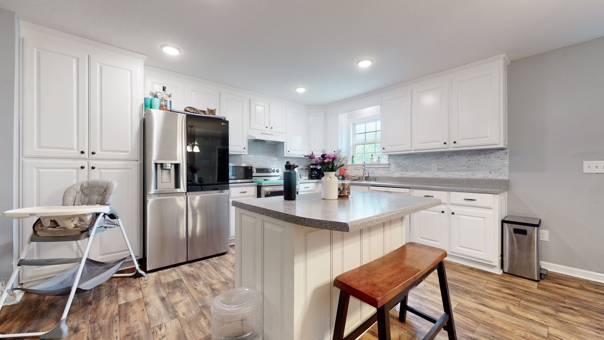 7018 Charity Road Petersburg, TN 37144 - Photo 9 of 25 a kitchen with refrigerator cabinets and chairs