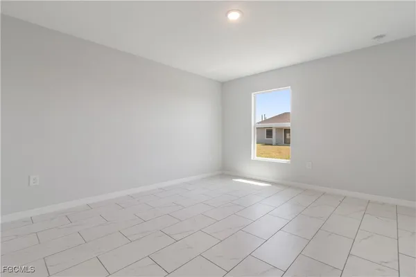 a view of an empty room and window