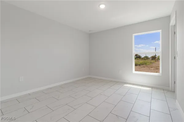an empty room with windows