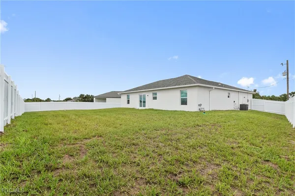 a big room with yard and fence