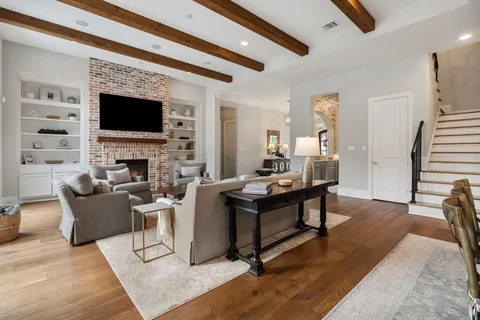 a view of a livingroom with furniture and a fireplace