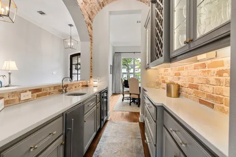 a kitchen with a sink stove and cabinets