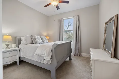 a bed room with a bed and a chandelier