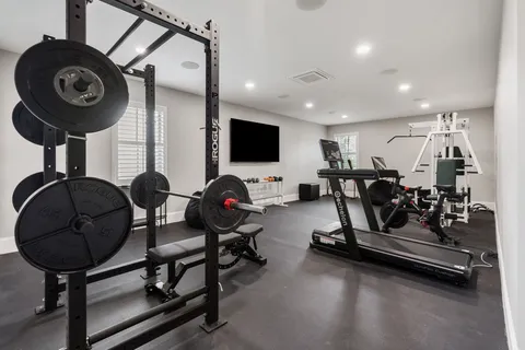 a view of a livingroom with furniture and a mirror