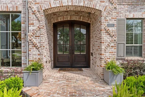 a front view of a house with a glass windows