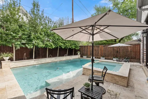 a view of a backyard with sitting area