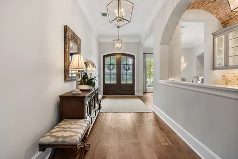 a view of a livingroom with furniture window and wooden floor