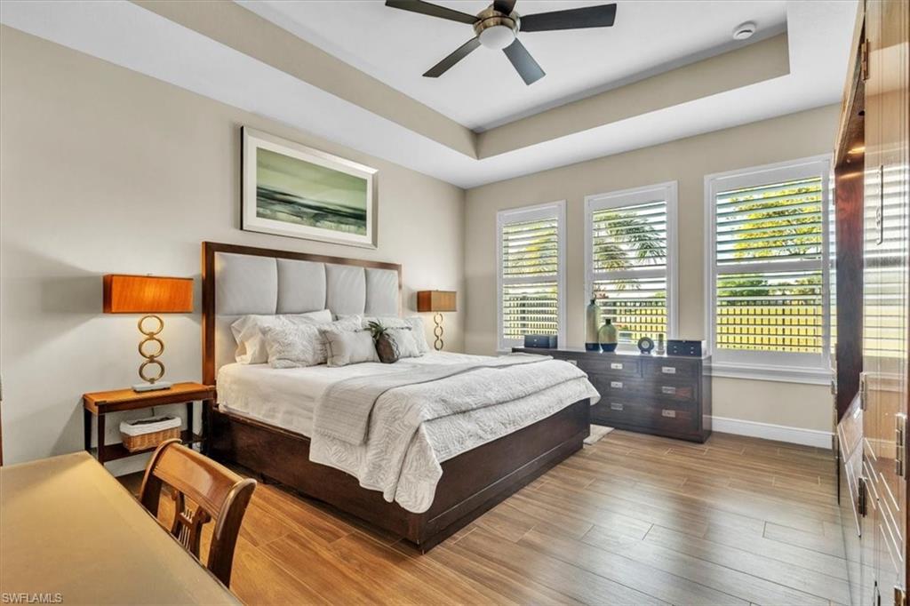 16424 Windsor Way Alva, FL 33920 - Photo 16 of 48 a bedroom with a bed and wooden floor