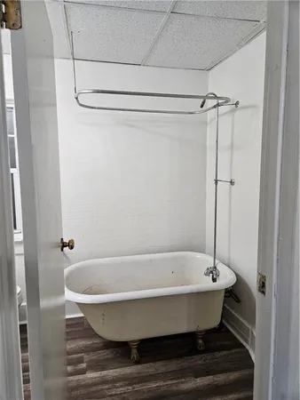 a bathroom with a tub and shower