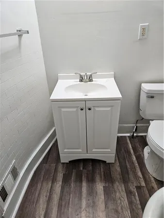 a bathroom with a sink toilet and vanity