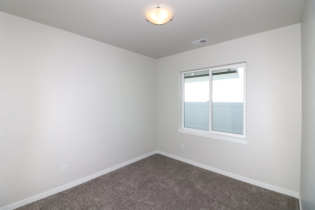 810 Rupp Avenue Palisade, CO 81526 - Photo 15 of 27 an empty room with a window