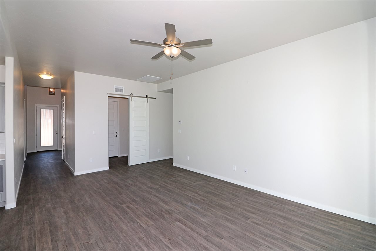 810 Rupp Avenue Palisade, CO 81526 - Photo 16 of 27 a view of an empty room with wooden floor