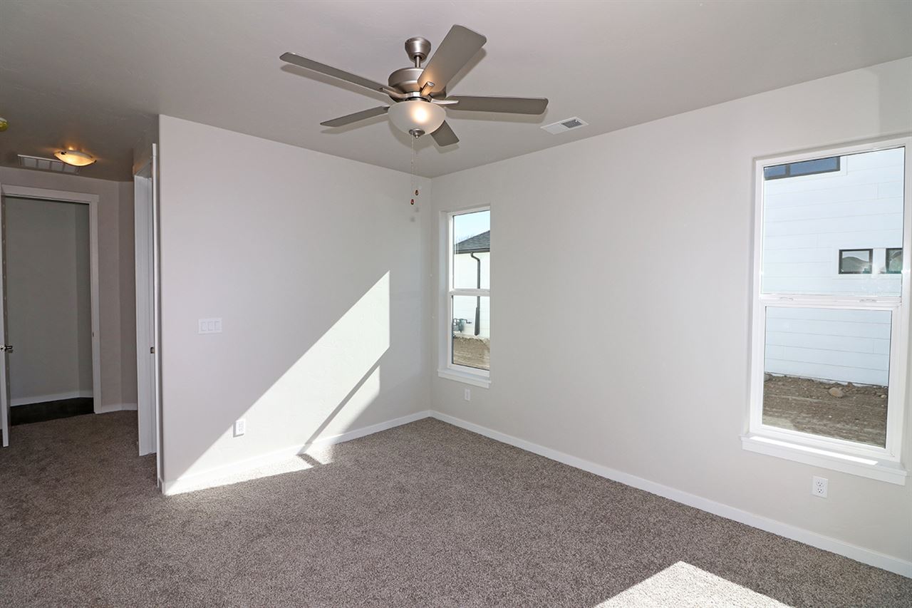 810 Rupp Avenue Palisade, CO 81526 - Photo 20 of 27 a view of a livingroom with a ceiling fan and window