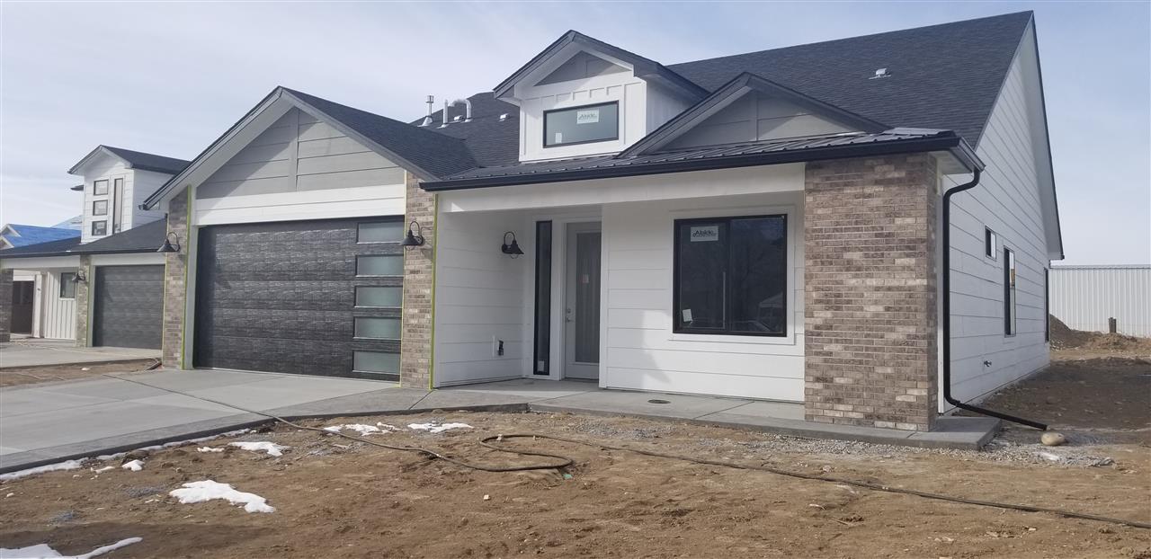 810 Rupp Avenue Palisade, CO 81526 - Photo 3 of 27 a front view of a house with a yard