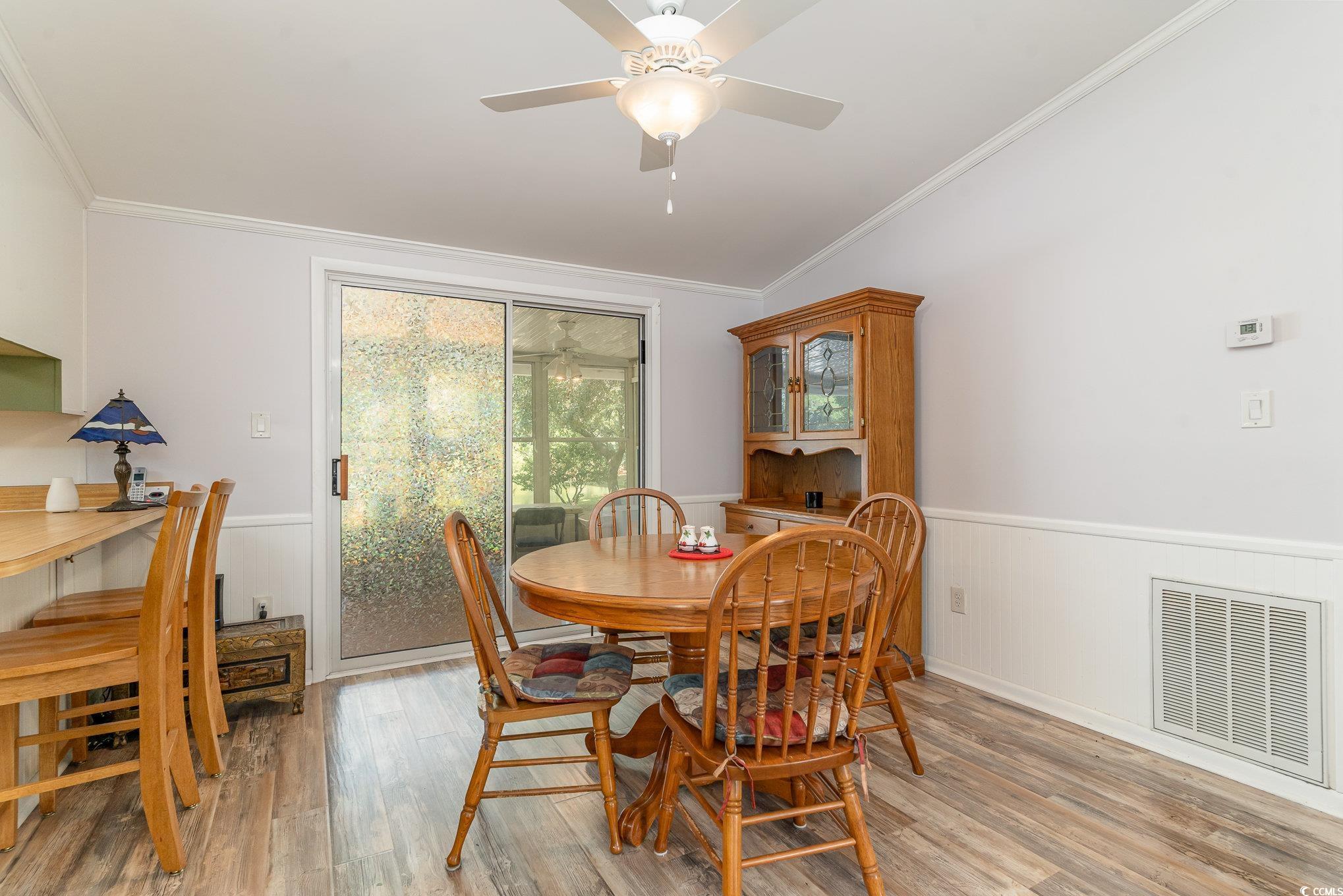 3215 Moonshadow Lane Murrells Inlet, SC 29576 - Photo 8 of 37 Dining space featuring ceiling fan, ornamental mol