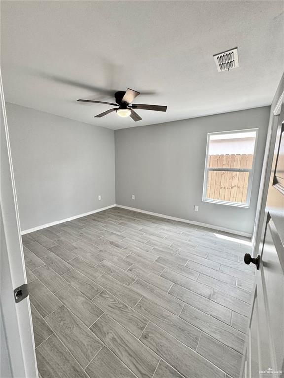 436 East Acacia Avenue, Unit 4 Alamo, TX 78516 - Photo 12 of 15 wooden floor in an empty room