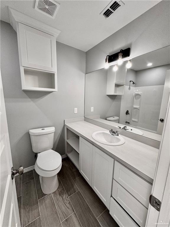 436 East Acacia Avenue, Unit 4 Alamo, TX 78516 - Photo 13 of 15 a bathroom with a sink toilet and mirror