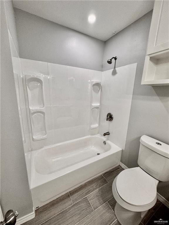 436 East Acacia Avenue, Unit 4 Alamo, TX 78516 - Photo 14 of 15 a white toilet sitting next to a bath tub