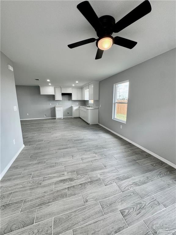 436 East Acacia Avenue, Unit 4 Alamo, TX 78516 - Photo 4 of 15 a view of empty room with wooden floor and window