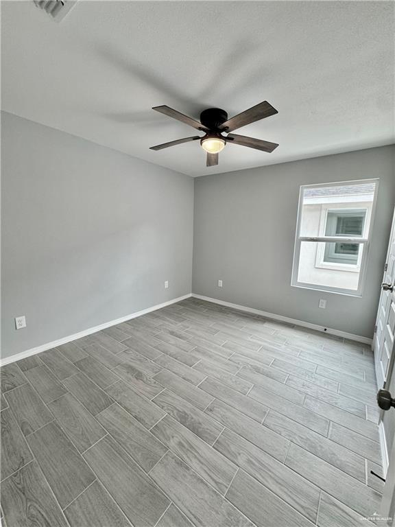 436 East Acacia Avenue, Unit 4 Alamo, TX 78516 - Photo 10 of 15 a view of an empty room with a window