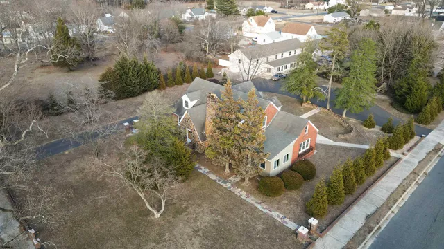 a view of a brick building next to a yard