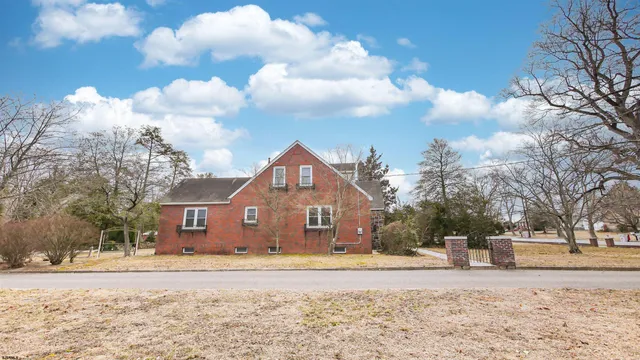 a kitchen with refrigerator and cabinets