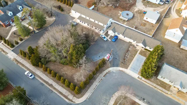 a view of a house with snow on the road
