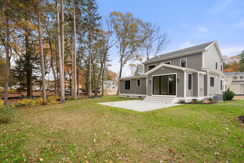 55 Country Farm Road Framingham, MA 01701 - Photo 8 of 8 a front view of a house with a yard