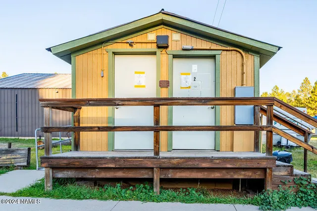 a front view of a house with a yard table and chairs