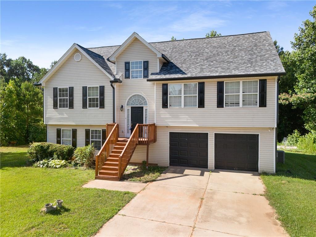 3667 Baker Road Gainesville, GA 30507 - Photo 1 of 1 a front view of a house with a yard and garage