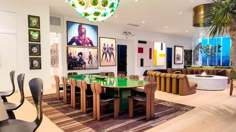 a view of a dining room with furniture kitchen and wooden floor